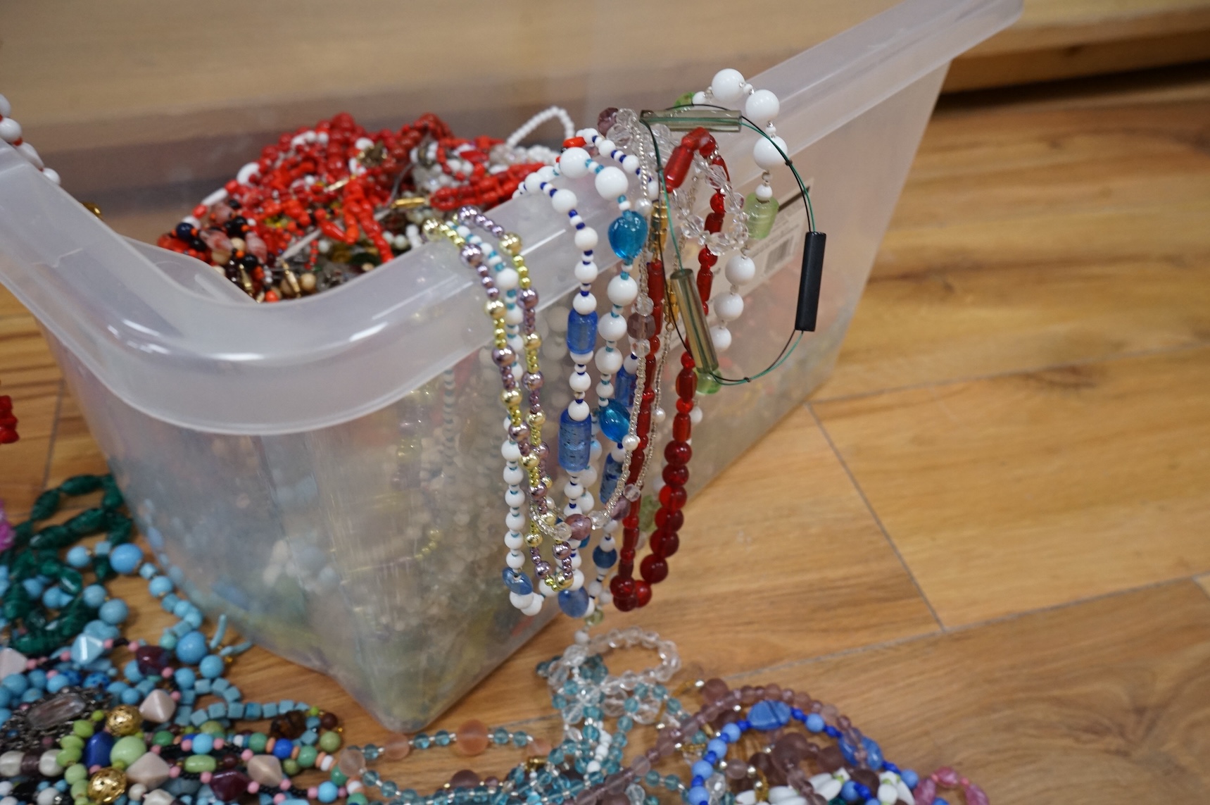 A large collection of glass bead necklaces